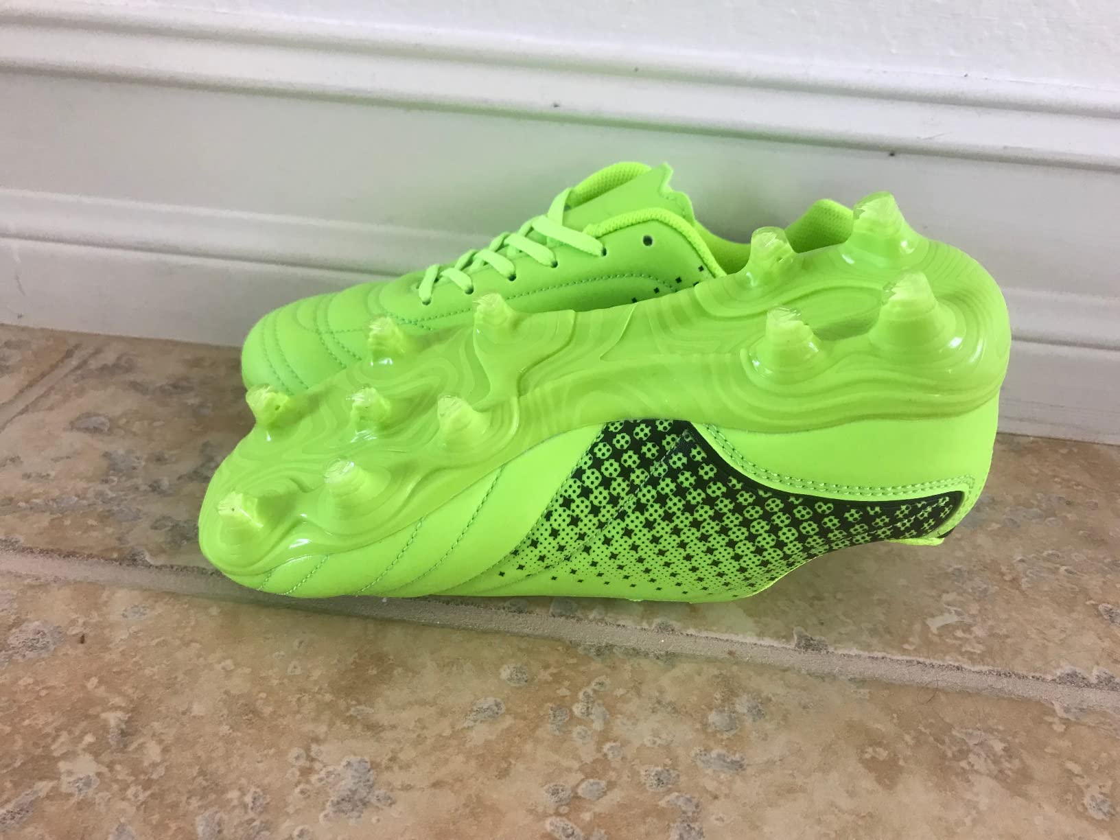 LIZRHA soccer cleats on natural grass field showing real-world usage context with player wearing them during game