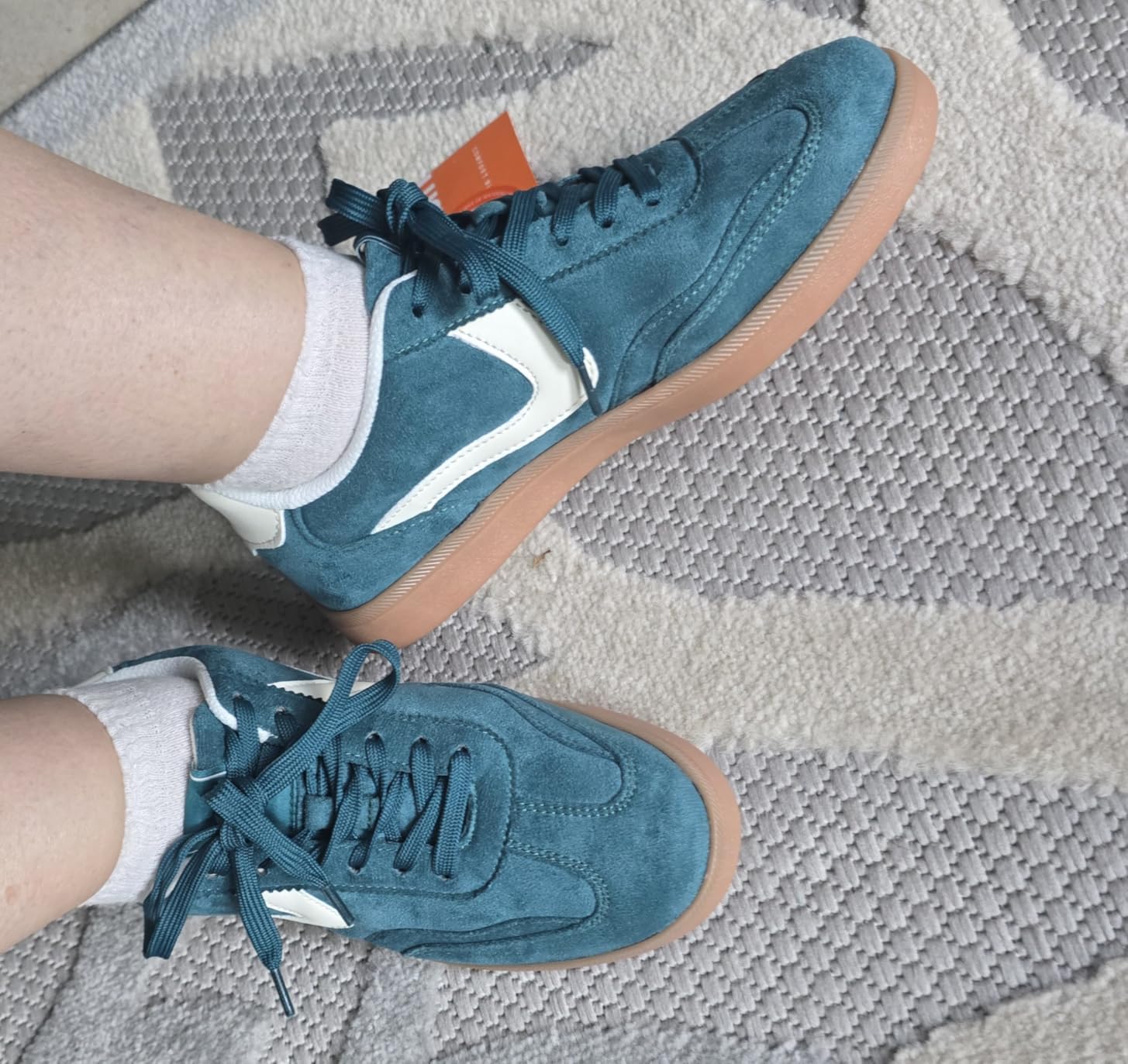 Close-up detail shot of LUCKY STEP sneaker showing PU leather upper construction and stitching quality