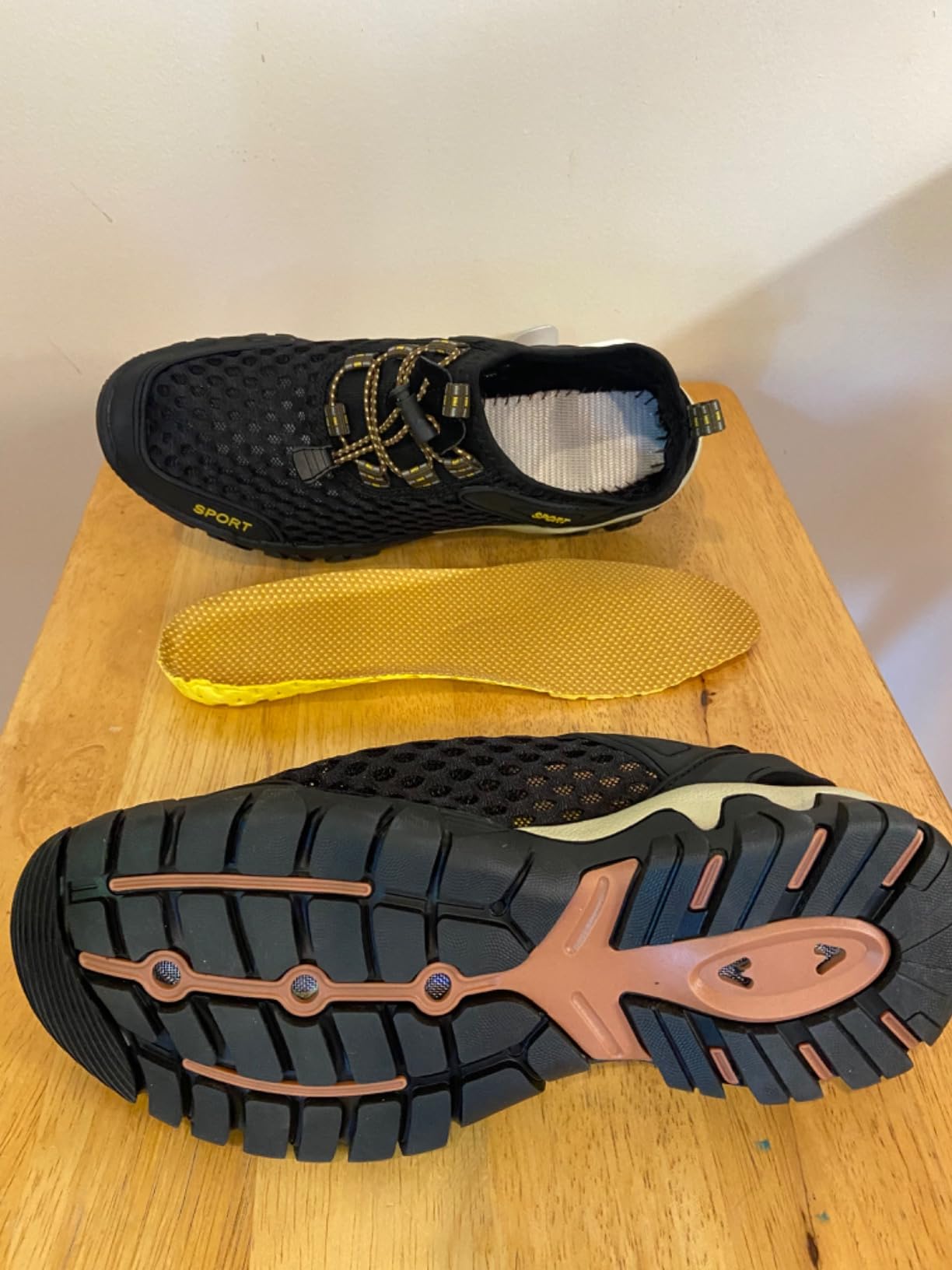 TrailBlitz water shoes on rocky shoreline showing sole traction pattern and toe protection
