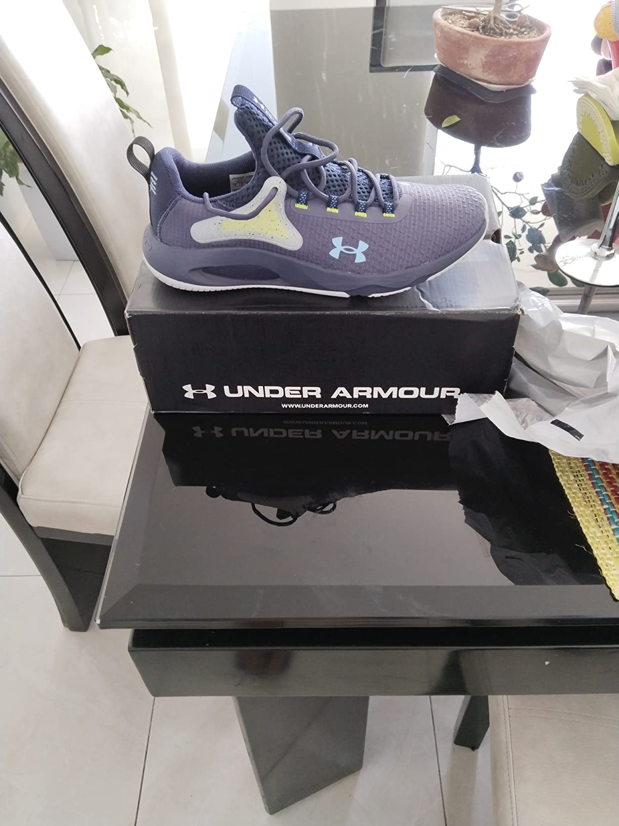 Under Armour Men's HOVR Rise 4 Training Shoe in black colorway showing HOVR cushioning technology