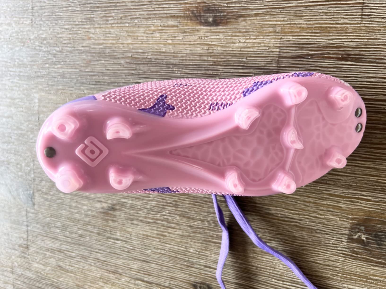 DREAM PAIRS soccer cleats in action on soccer field showing traction and ball control performance