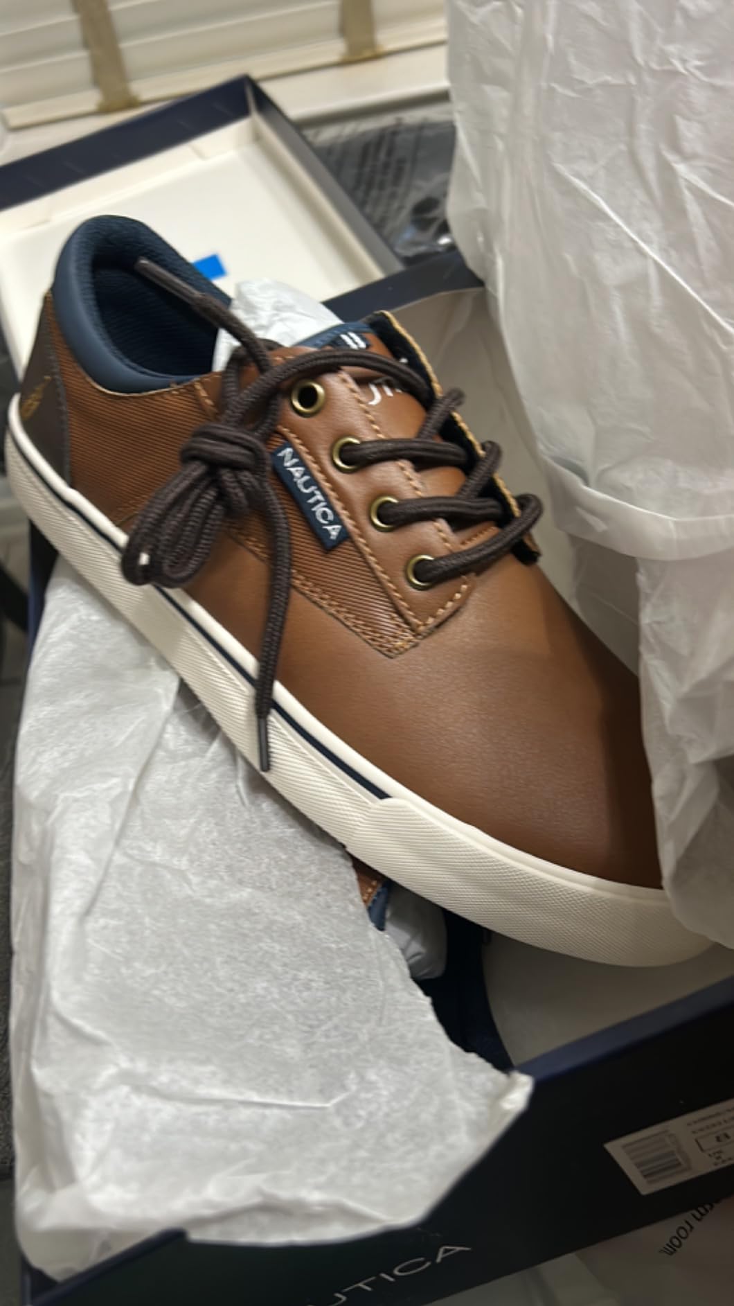 Wear patterns on Nautica boat shoes after 8 weeks of testing showing outsole wear and material condition