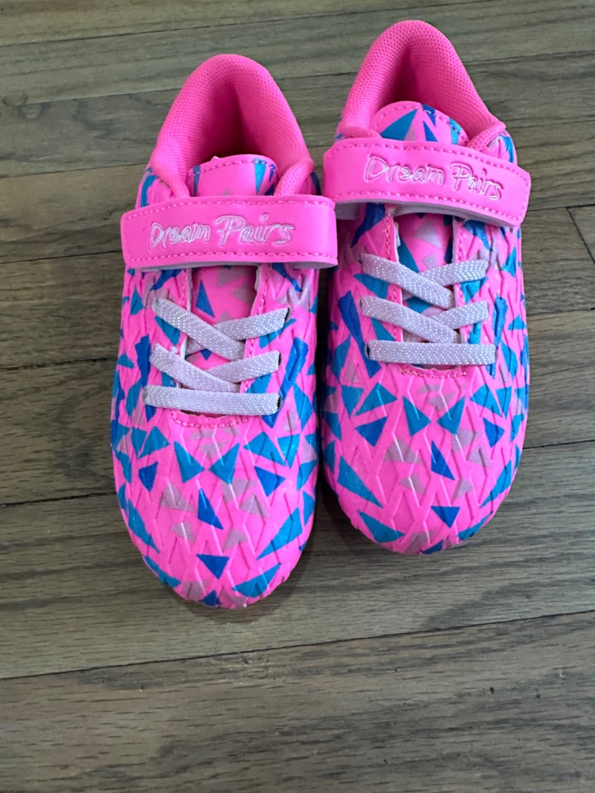 DREAM PAIRS soccer cleats being worn by young child showing proper fit and styling