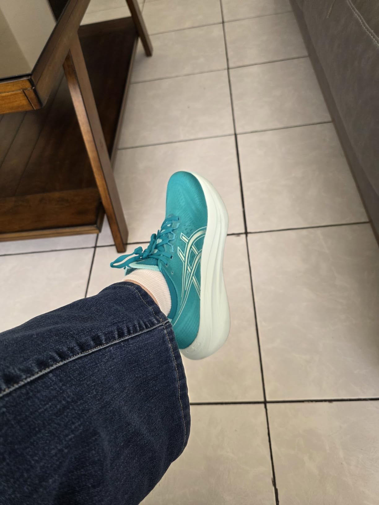 ASICS Gel-Nimbus 27 lifestyle shot showing versatile colorway perfect for active women