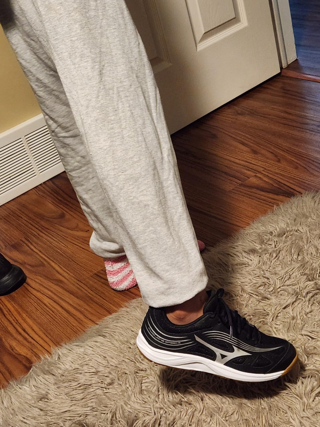 Mizuno Cyclone Speed 3 volleyball shoes shown on indoor court surface during gameplay, demonstrating lightweight profile and court-ready performance