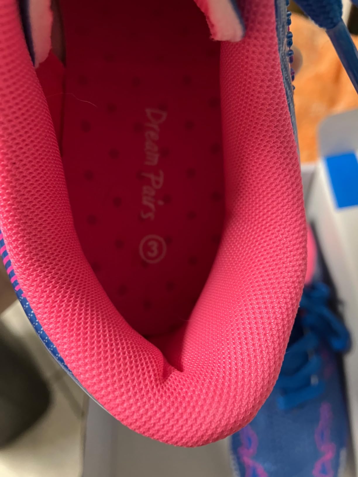 DREAM PAIRS soccer cleats side lacing design showing textured upper pattern and protective heel design