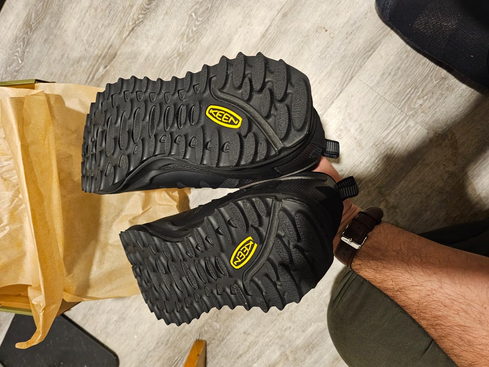 KEEN Zionic shoes in muddy trail conditions showing grip and traction on slippery surfaces