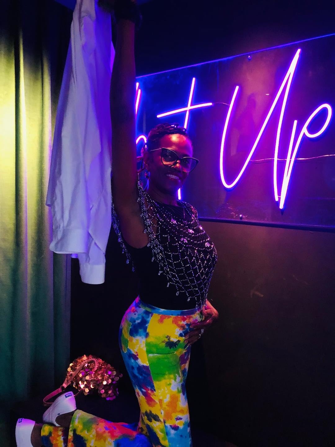 Woman wearing purple Keds Champion sneakers with jeans showing styling versatility