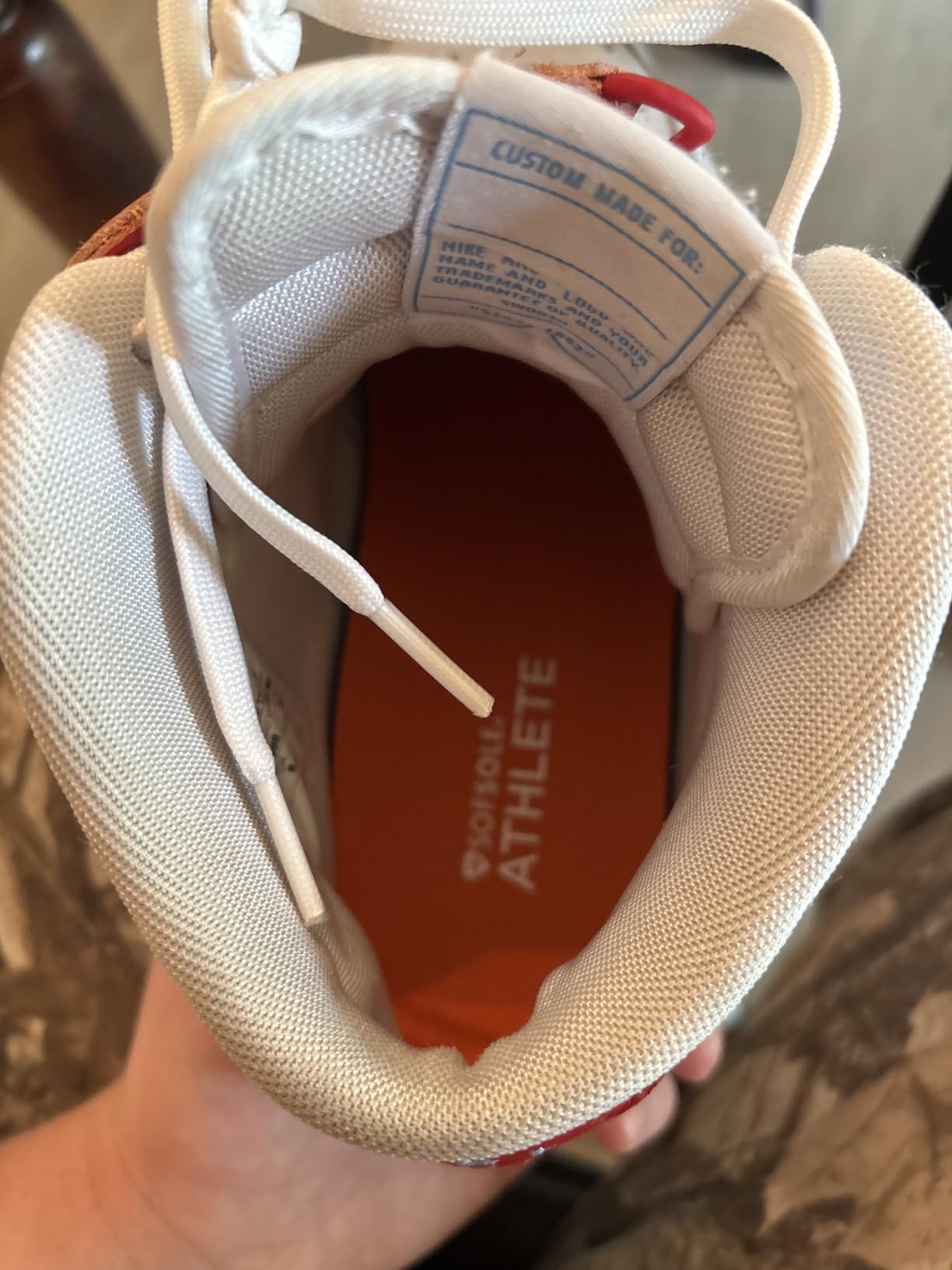 Sof Sole Athlete insoles showing orange gel heel and forefoot cushioning with neutral arch design