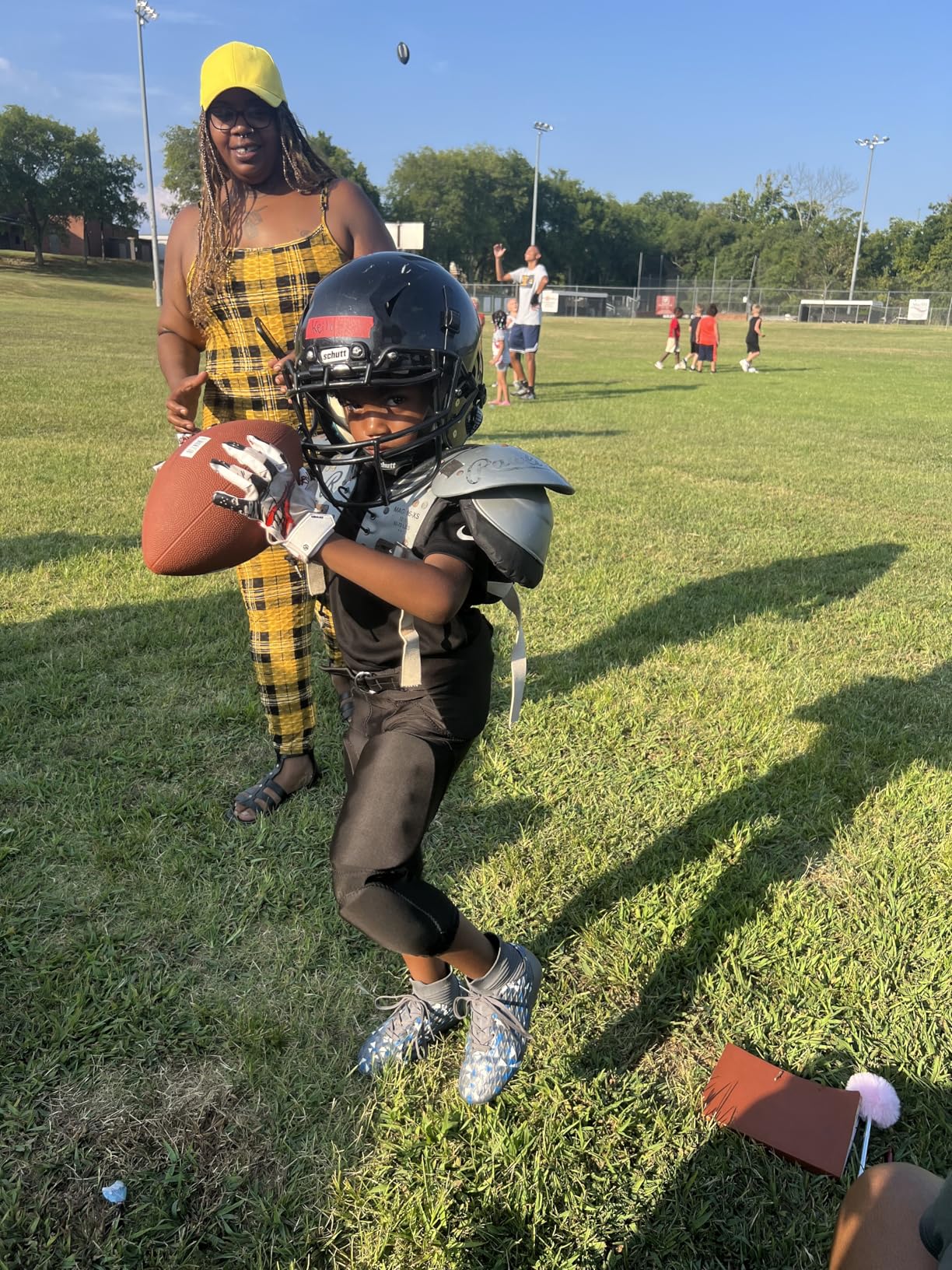DREAM PAIRS soccer cleats side view showing high ankle collar and lacing system