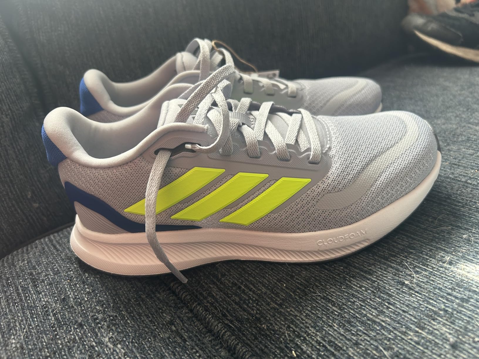 Adidas Run Falcon 5 kids sneaker showing black design with hook and loop closure