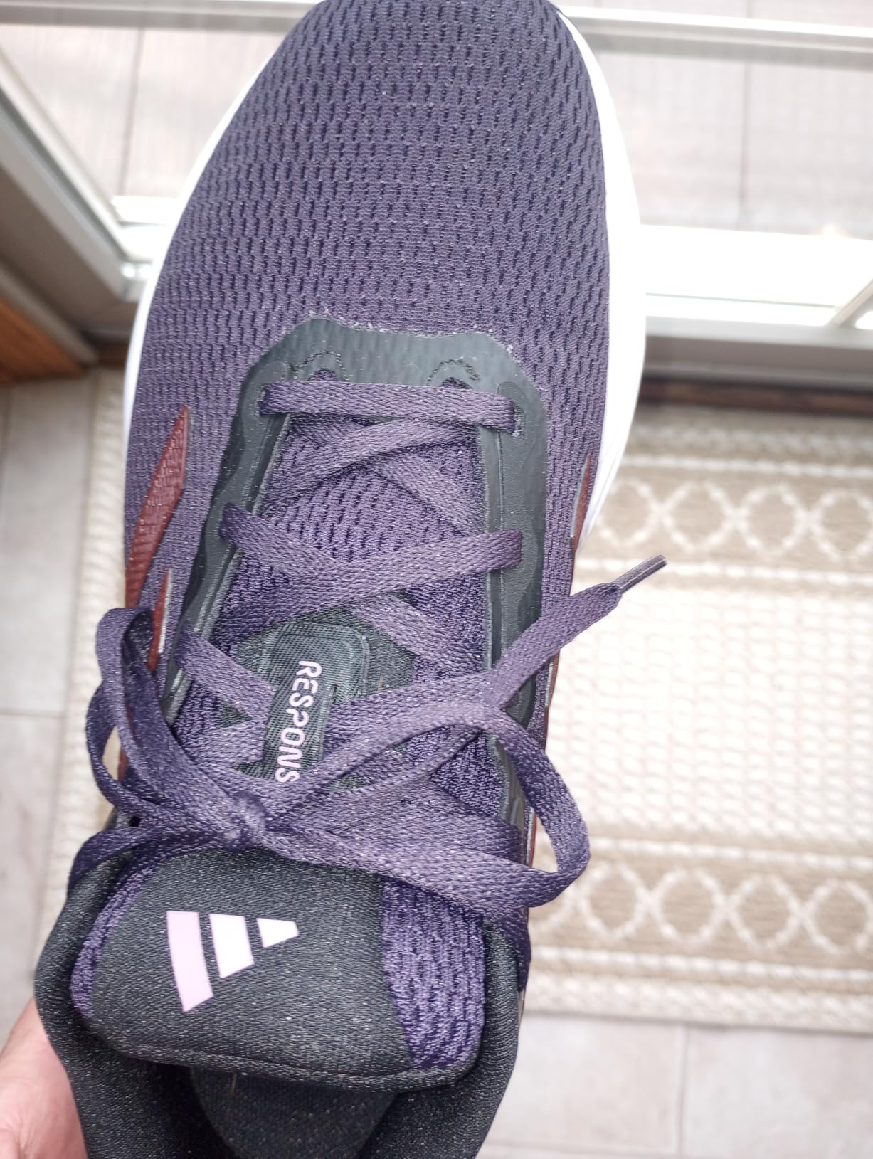 Adidas Response sneaker detailed side view showing mesh upper and EVA midsole construction