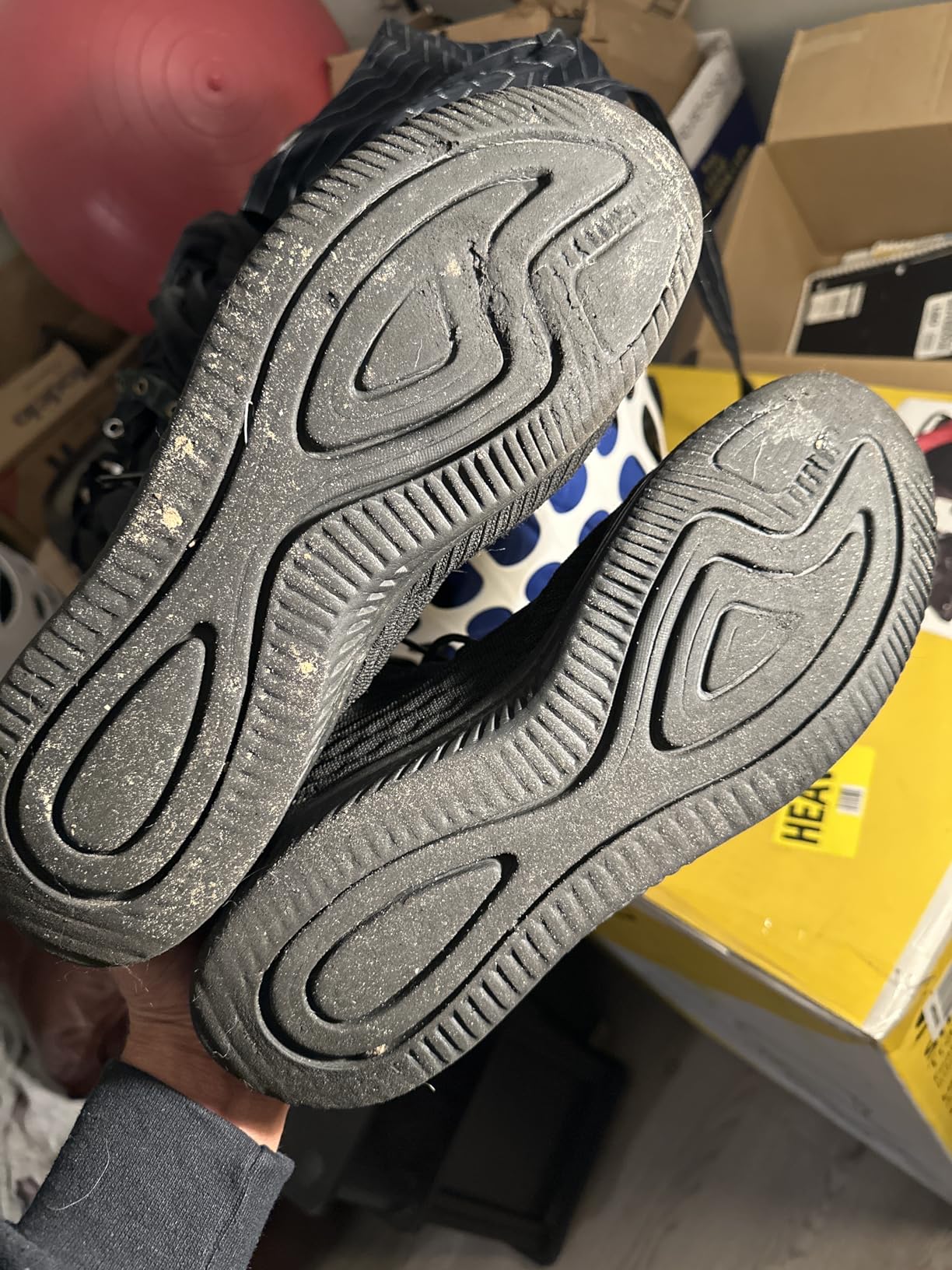 Close-up of AMANSSE shoe sole showing EVA foam construction and tread pattern design