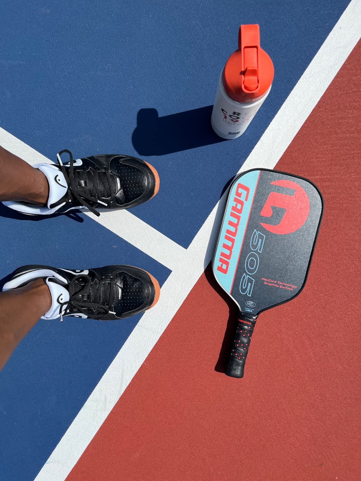 HEAD Grid 2.0 court shoe showing black and white colorway with non-marking gum sole