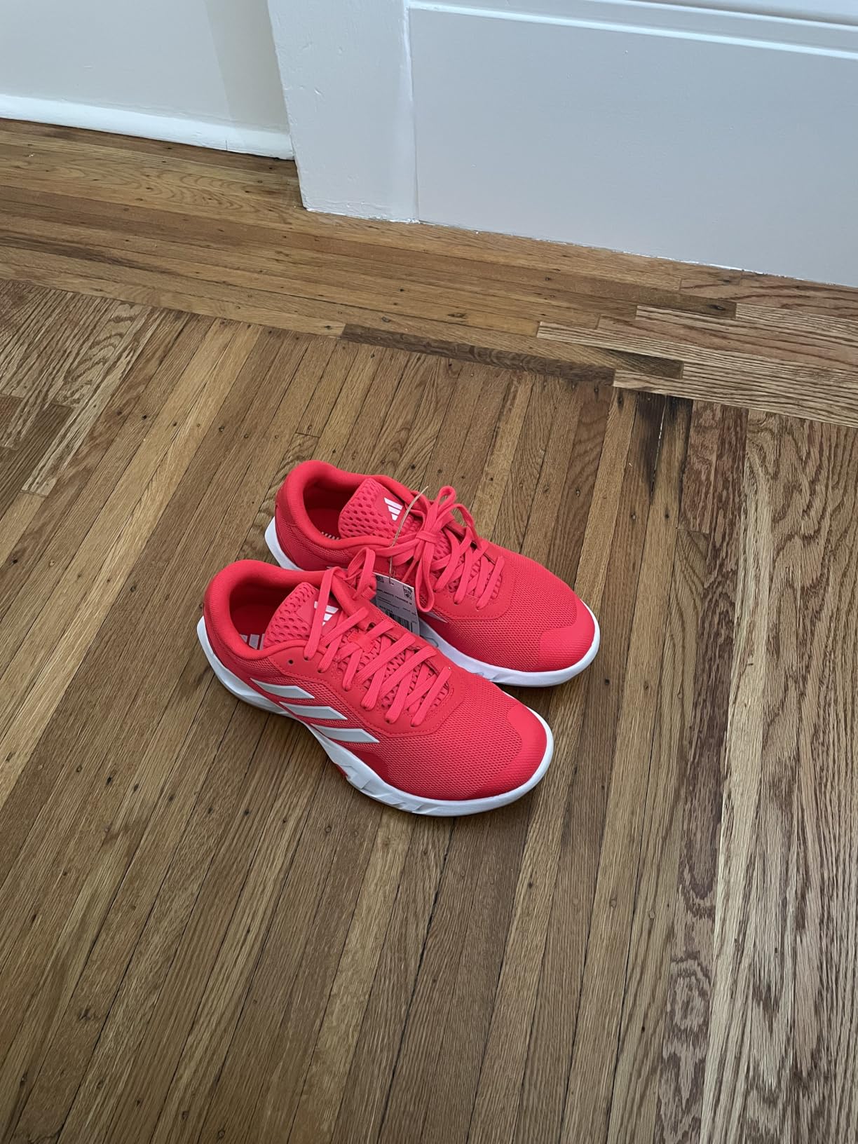 Adidas Amplimove Training Sneaker in Lucid Red showing mesh upper and lateral support design