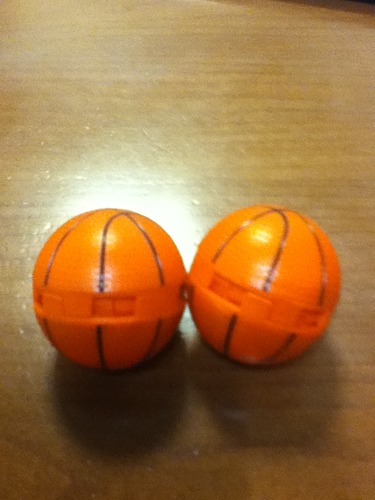 Basketball themed sneaker balls deodorizer showing orange and black design with twist mechanism