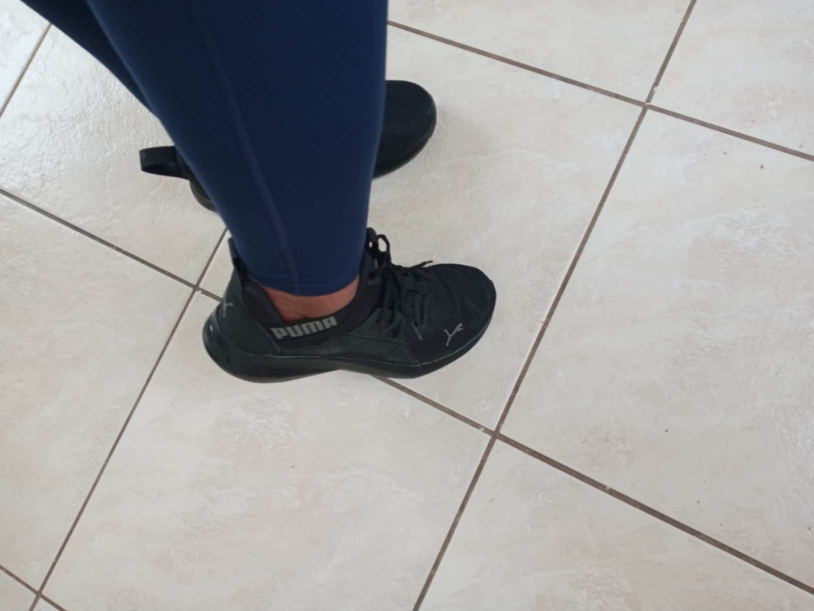 Close-up construction detail of PUMA Softride Enzo 5 showing TPU caging system, EVA upper material quality, and build craftsmanship