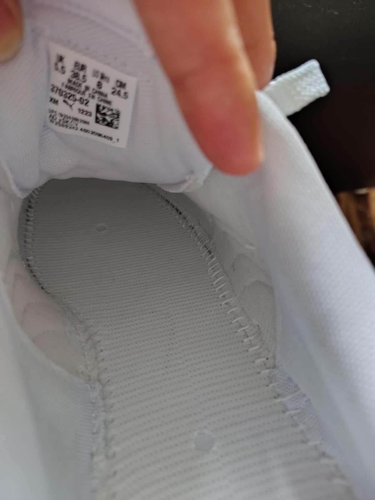 PUMA Carina L sneaker detailed side view showing premium leather construction and elevated platform sole