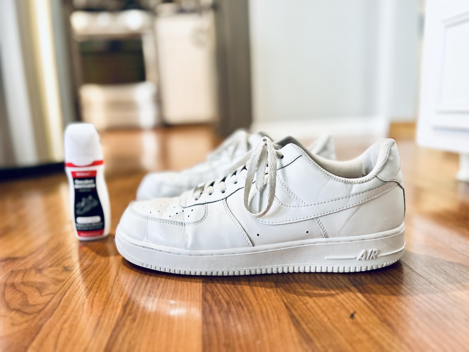 Wilkins Sneaker Whitener bottle with sponge applicator showing before and after results on white sneakers