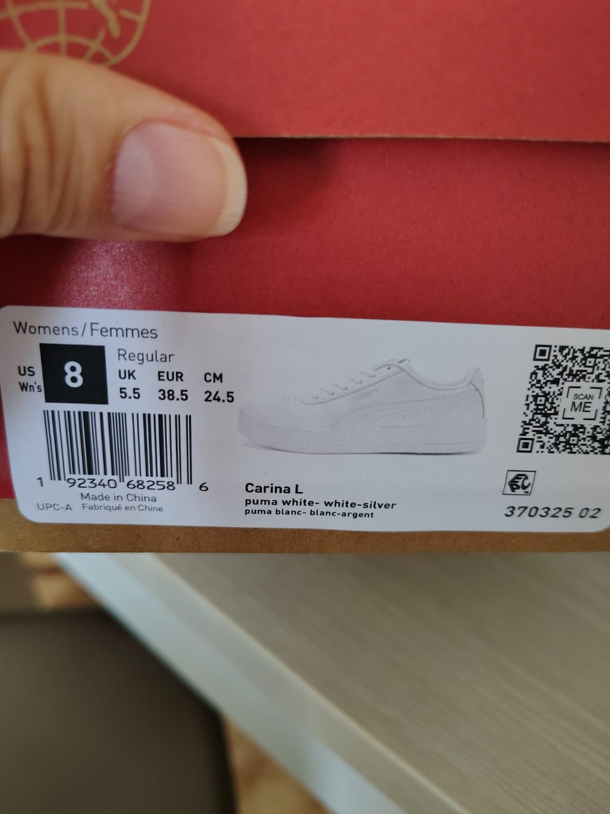 PUMA Carina L sneaker worn in real-world setting showing versatility with casual outfit