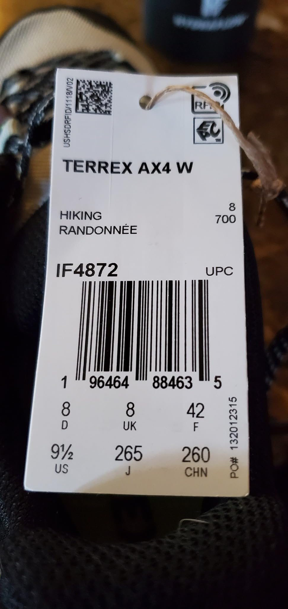 Close-up detail of Adidas Terrex AX4 breathable mesh upper construction with synthetic overlays and traditional lacing system