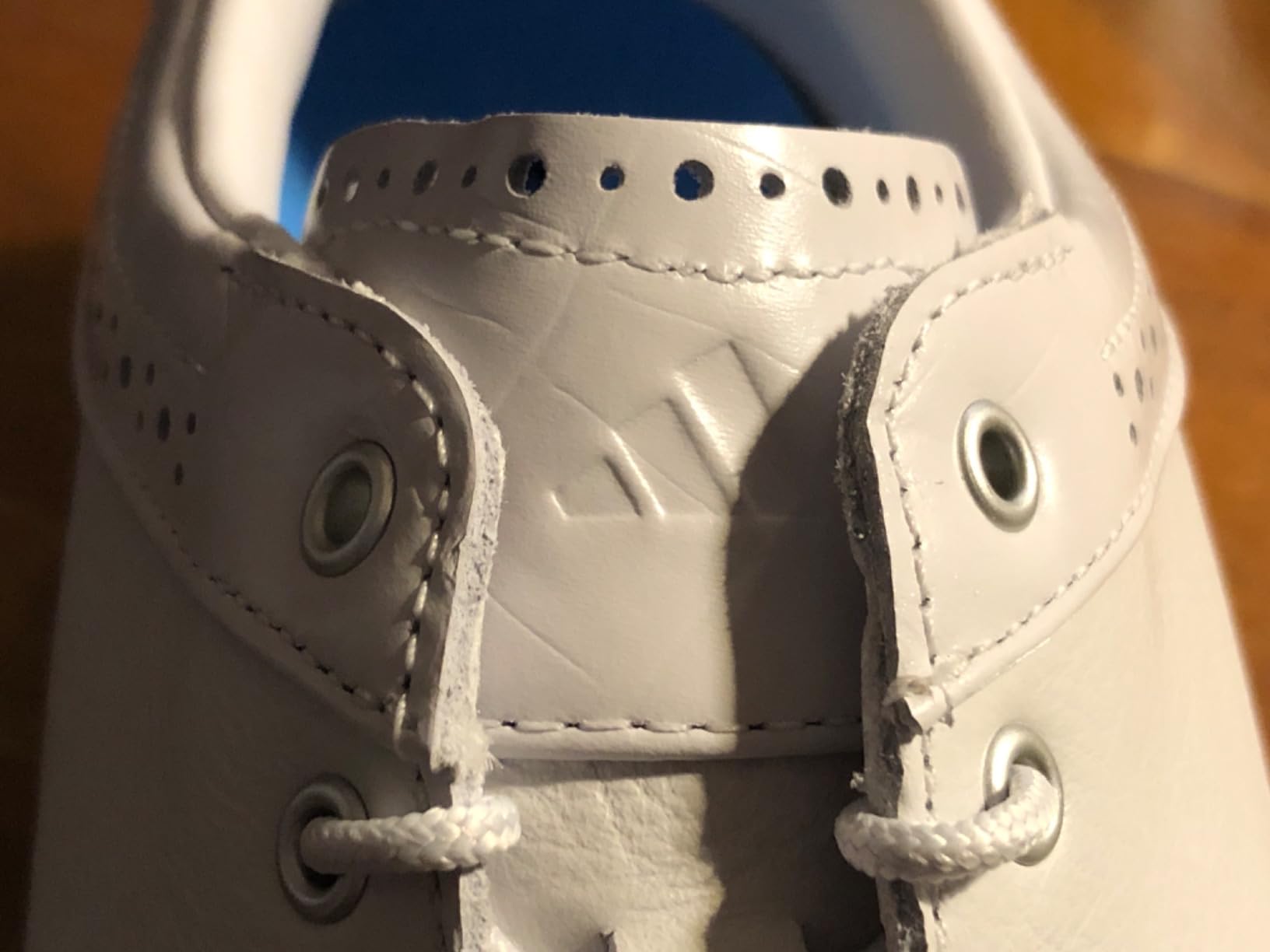 Close-up view of Adidas MC80 golf shoe leather construction and classic detailing