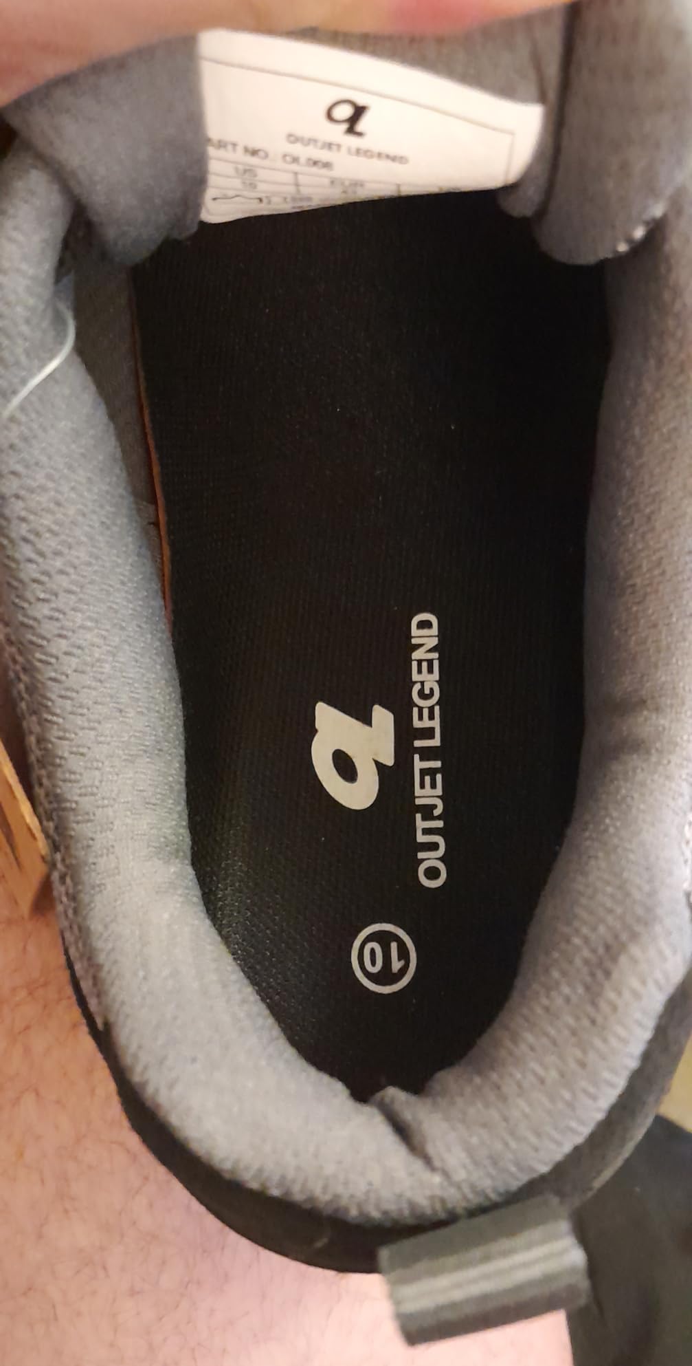 Close-up view of OL OUTJET LEGEND shoe showing cowhide leather upper quality, stitching detail, and construction at the toe box area