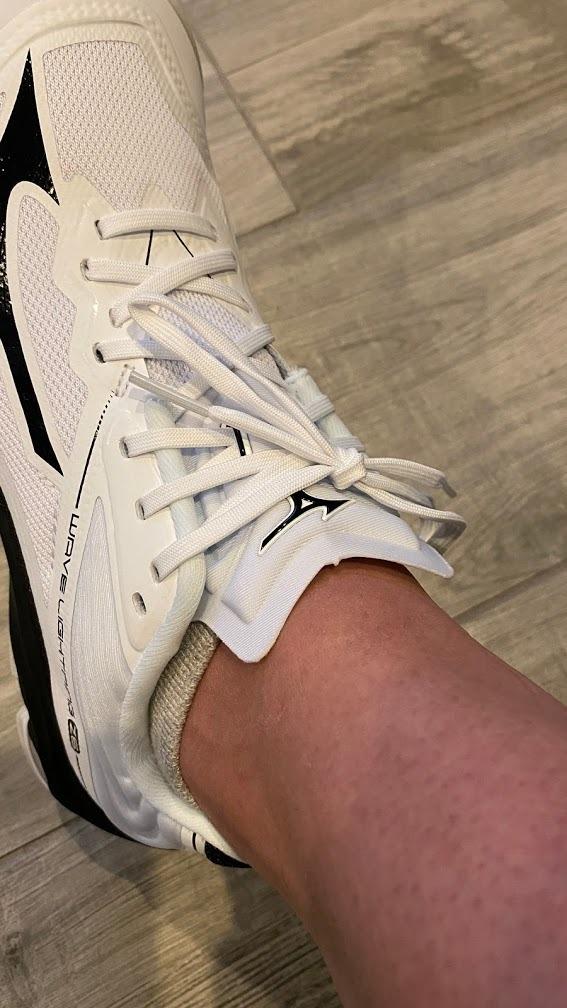 Mizuno Wave Lightning Z6 mesh upper construction showing half-bootie collar and engineered support overlays