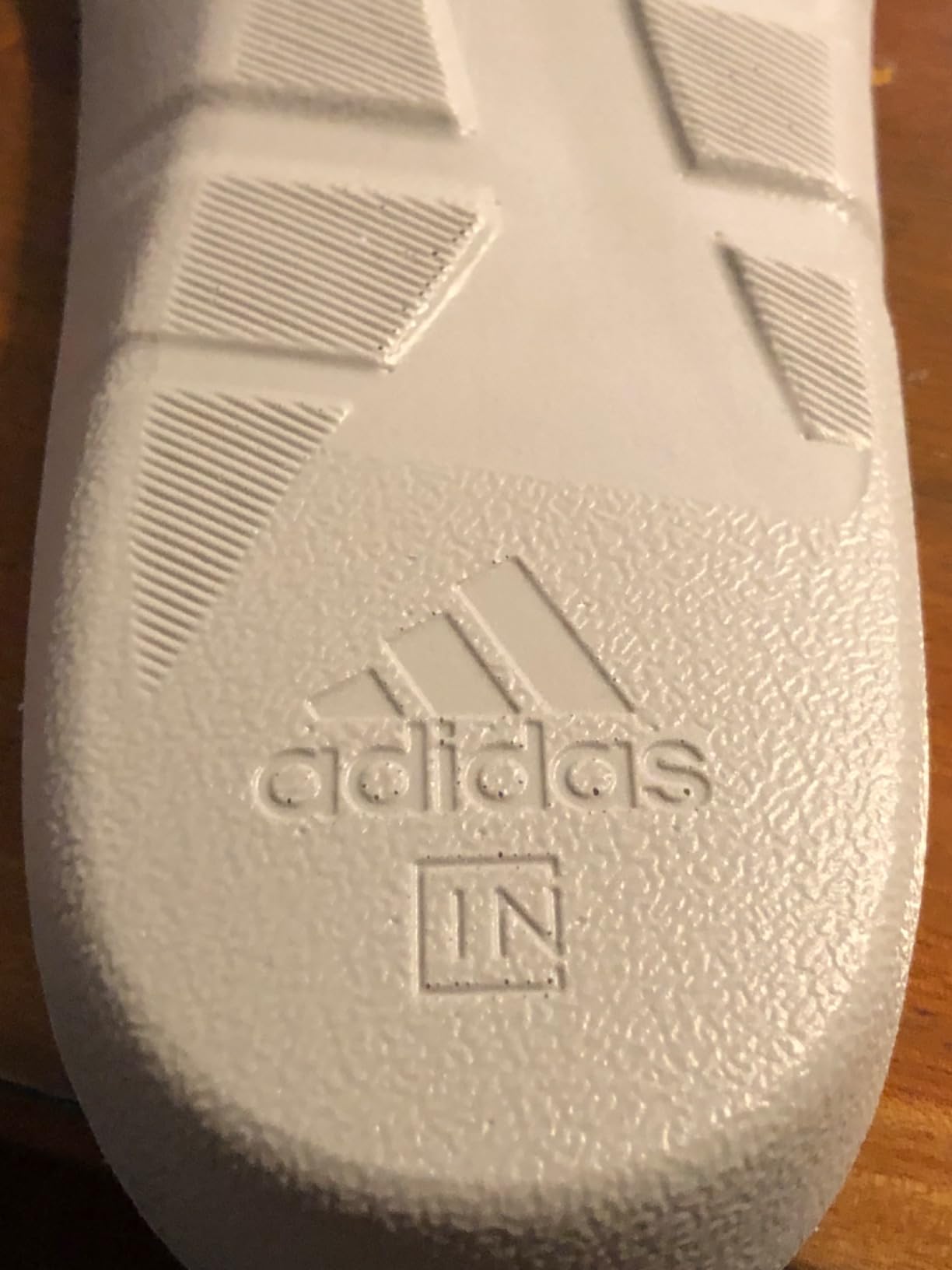 Adidas MC80 golf shoes showing outsole traction pattern and spikeless design