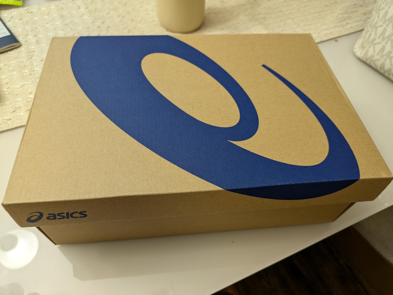 ASICS Men's Solution Swift FlyteFoam 2 tennis shoe side profile showing white and blue colorway