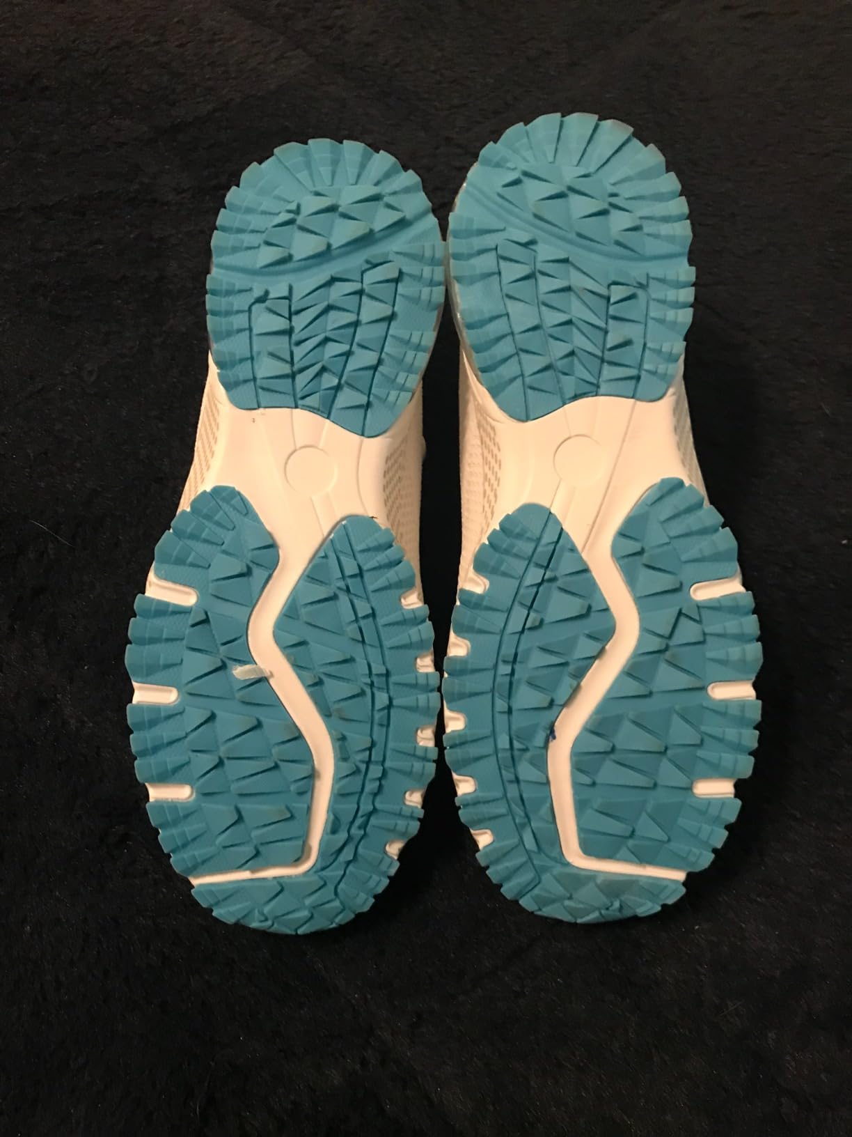 Side view of ZOOMCO Women's sneakers showing mesh ventilation panels and cushioned midsole detail