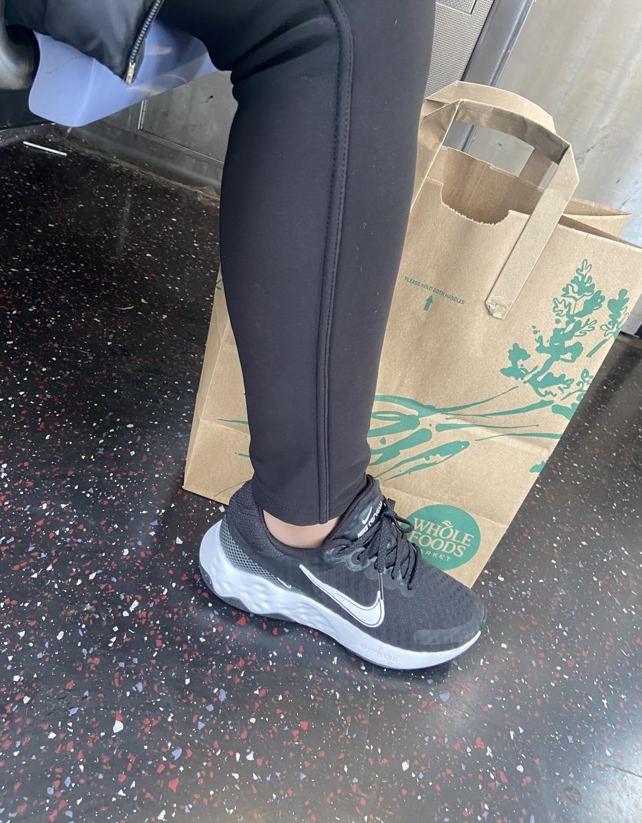 Nike Women's Renew Ride 3 heel profile showing Nike Renew foam midsole stack and heel cushioning construction