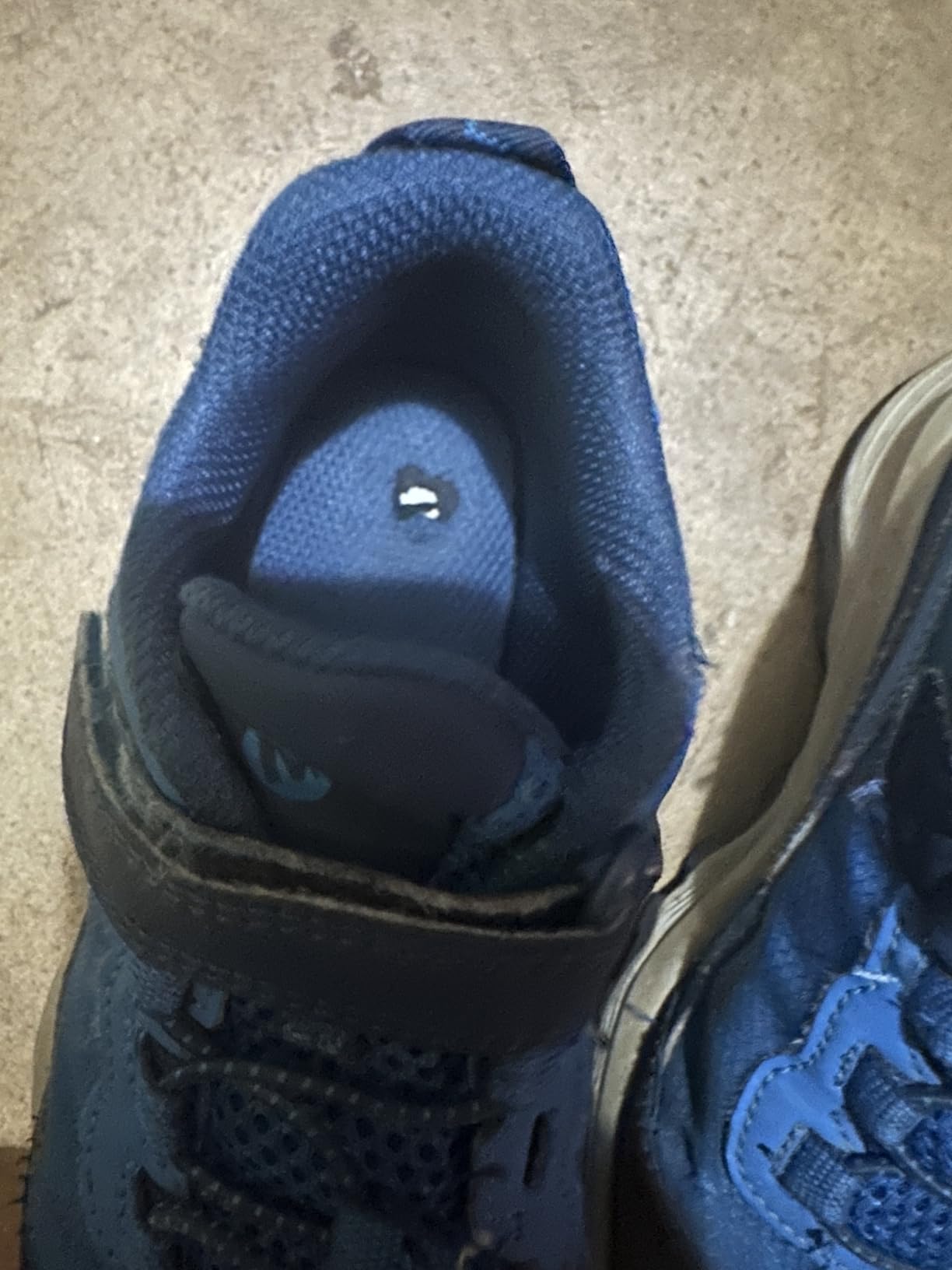 Close-up of Merrell Moab Speed Low alternative closure system showing velcro strap and lace combination