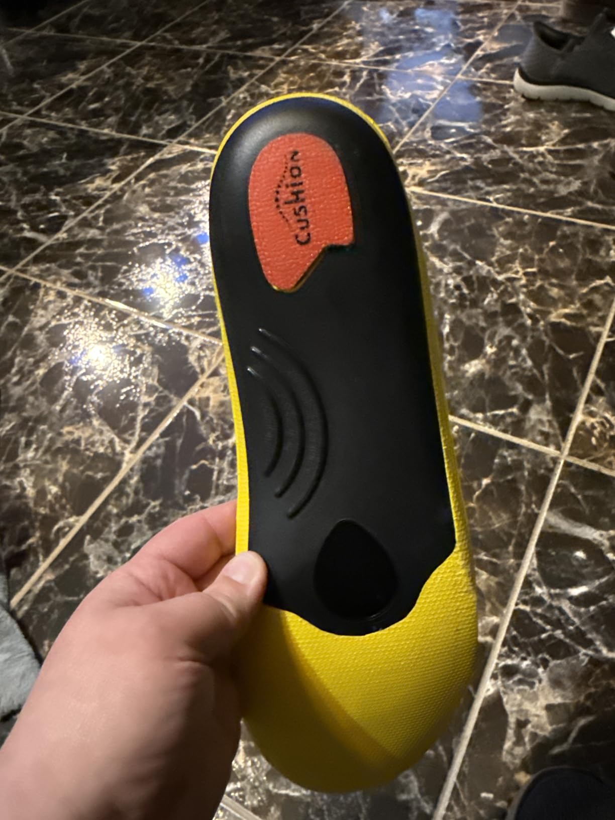 VALSOLE insoles fitted in work boots showing proper placement and heel cup position