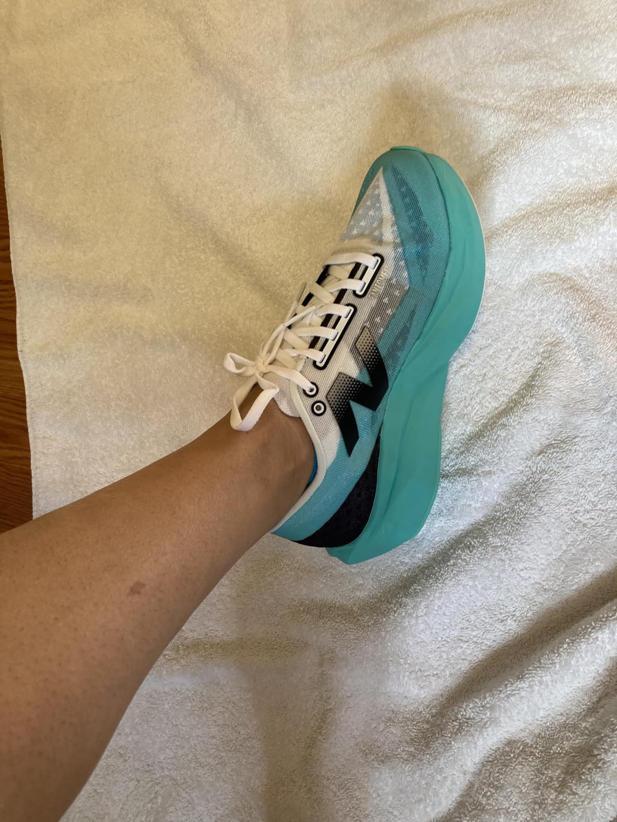 Close-up detail of FuelCell Rebel V4 mesh upper construction and sublimated graphics