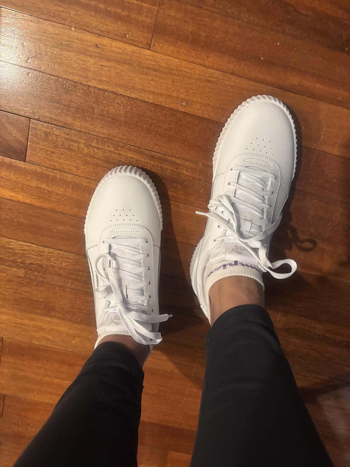 PUMA Women's Carina L white leather sneaker showing retro California-inspired design with platform sole