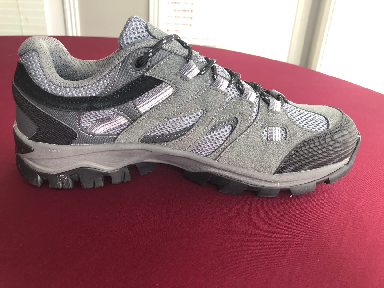 Close-up of CAMELSPORTS hiking shoes showing anti-collision toe cap and lacing system detail