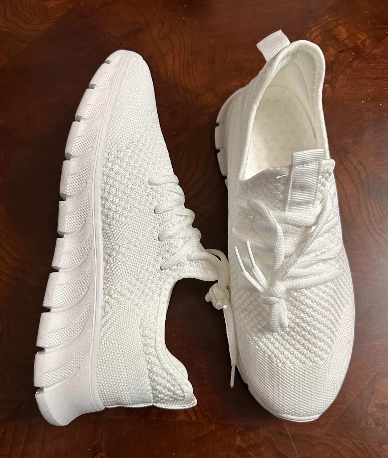 Women wearing GDEKLO white athletic sneakers showing casual daily styling versatility