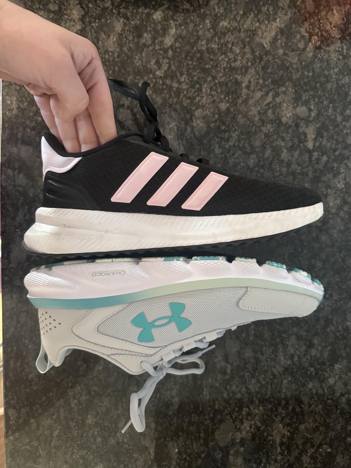 Under Armour Women's Charged Assert 9 running shoes in black and pink colorway on white background