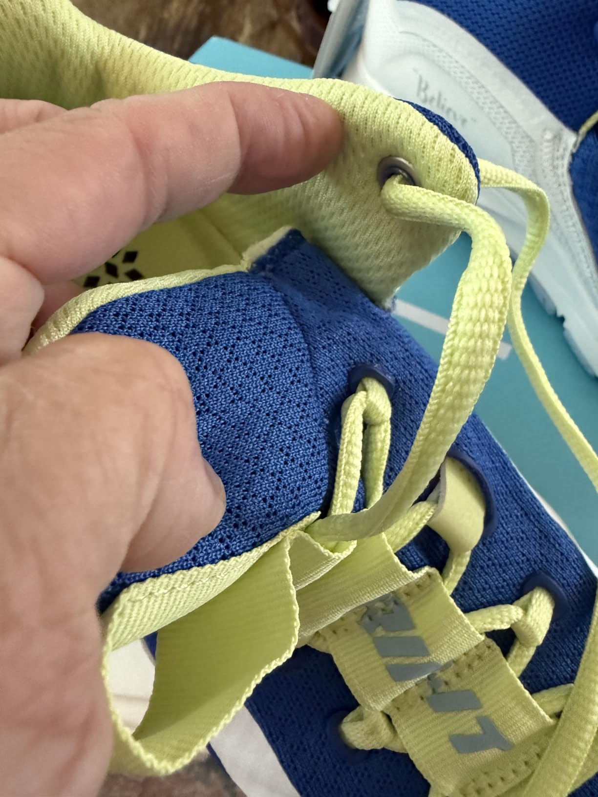 PUMA Voltaic Evo side profile detail showing mesh construction TPU cage overlay and integrated lacing system