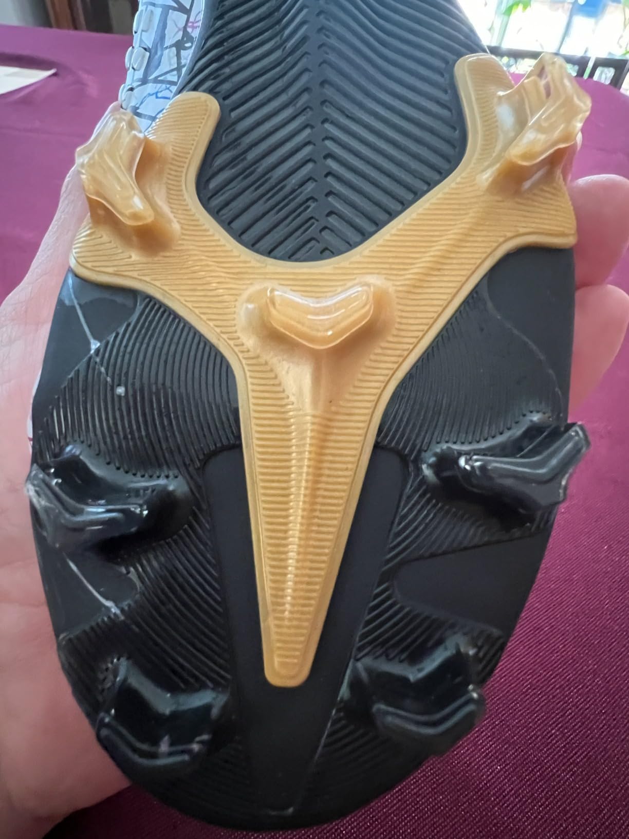 Close-up of high-ankle collar design and lacing system