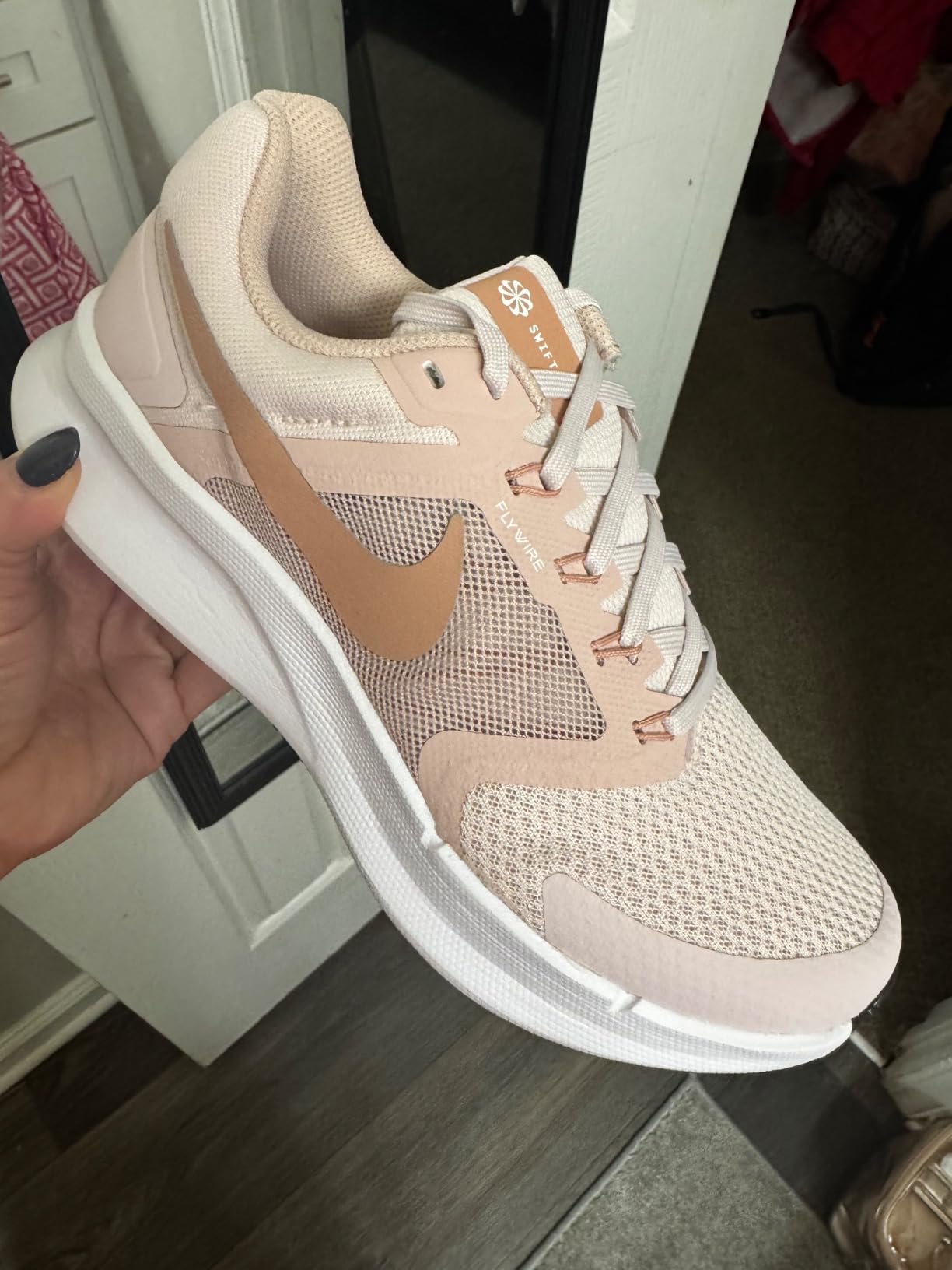 Nike Air Winflo 9 detail shot showing engineered mesh upper and metallic silver accents