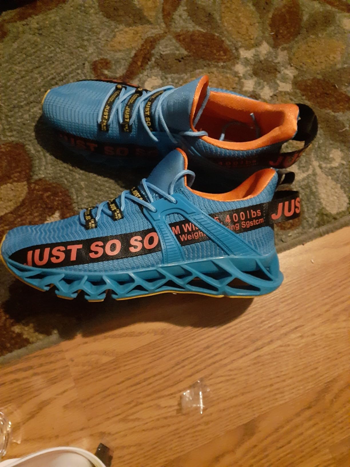 WONESION Mens Breathable Walking Tennis Running Shoes white colorway showing blade sole design