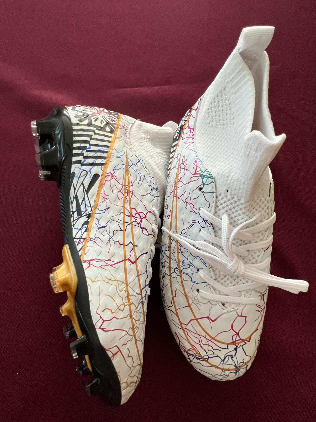 Youth player wearing cleats on soccer field showing real-world fit