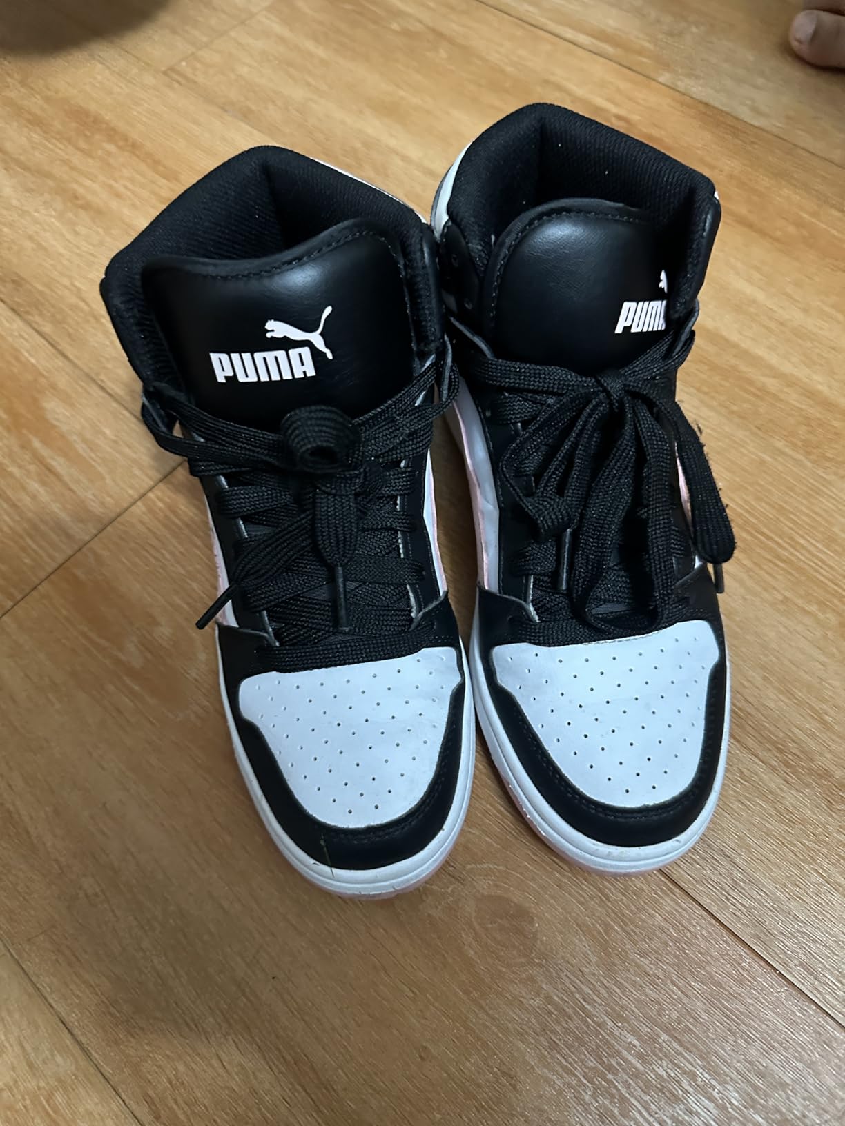 PUMA Rebound Layup Mid kids basketball shoe high-top design showing black and white retro styling