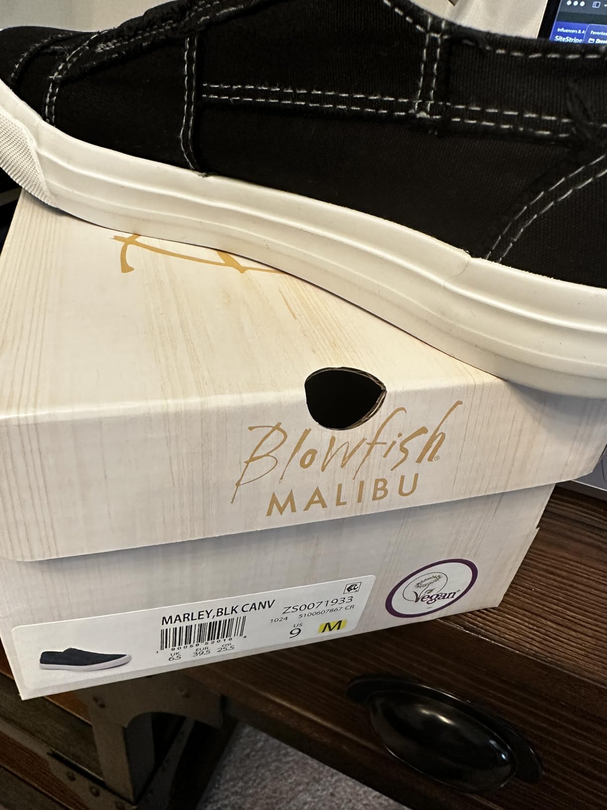 Blowfish Marley sneaker showing actual black shoe with white stitching detail