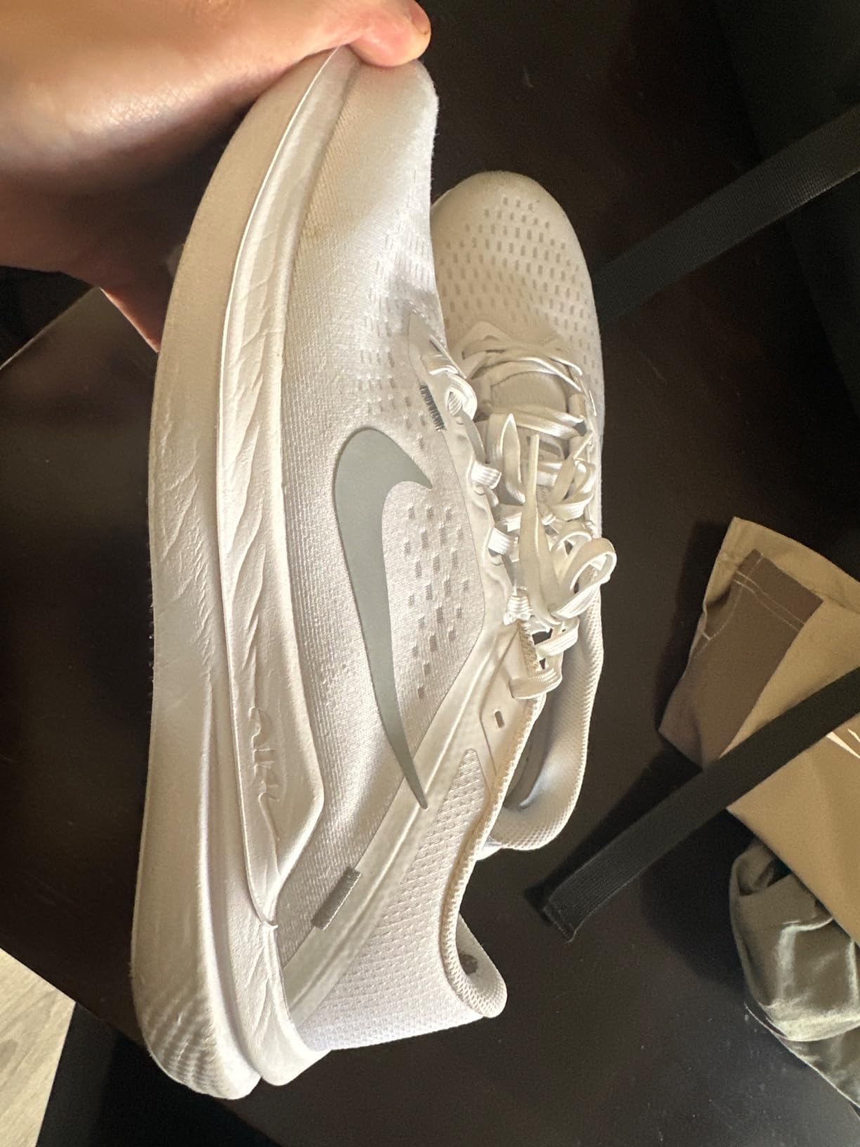 Nike Winflo 10 men's running shoes black colorway showing mesh upper and Air cushioning