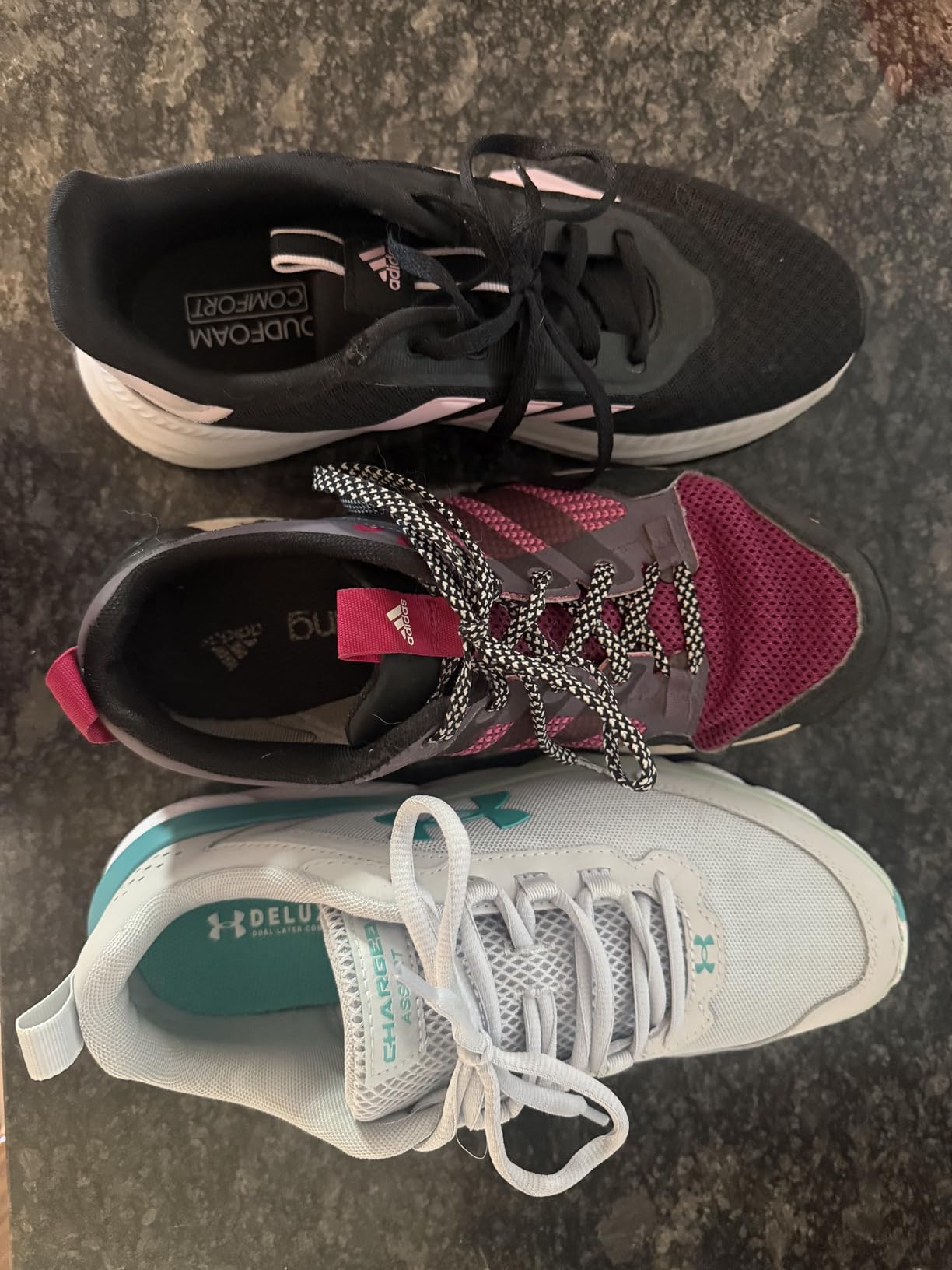 Under Armour Charged Assert 9 outsole showing rubber traction pattern and tire-inspired tread design