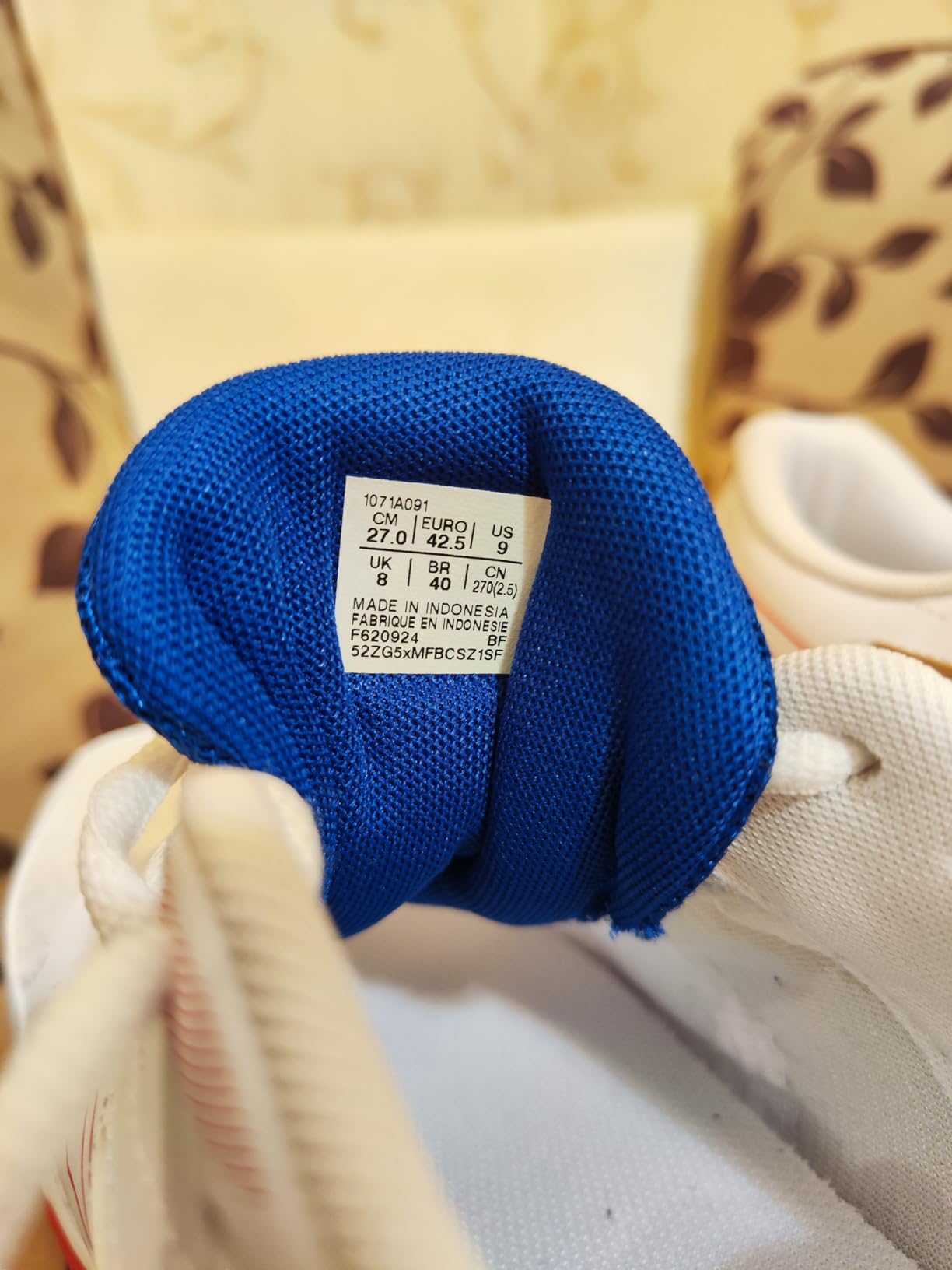 ASICS Gel-Rocket 11 side profile view showing full court shoe silhouette and ankle support height