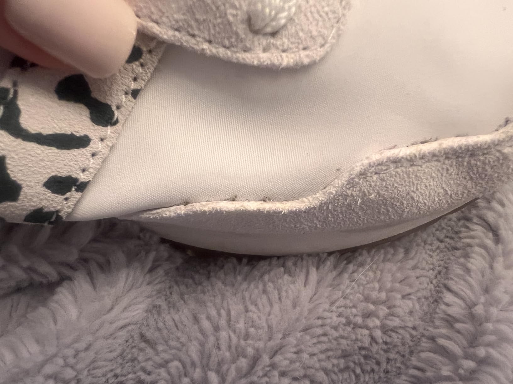 Detail view of retro exposed foam tongue and mesh upper construction